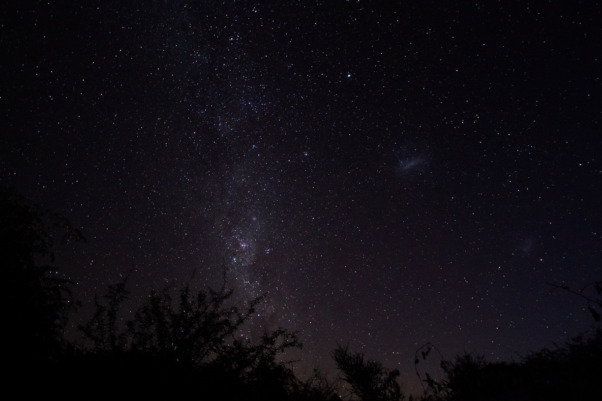 The snow-filled lands around Pulju, Lapland, sparkle as the near full moon illuminates the frozen lake.  To the left of the flared moon lies Jupiter; above, the Pleiades.