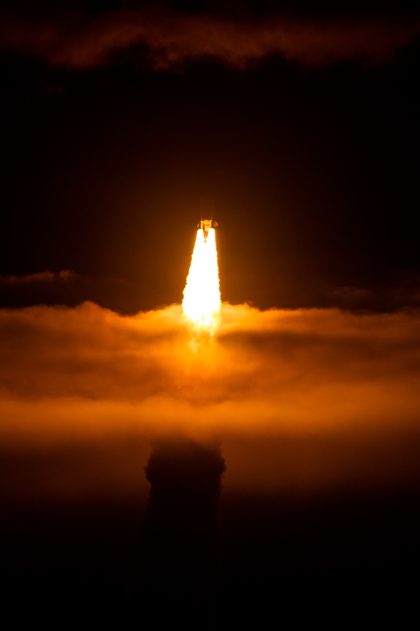 NASA's baby space shuttle, Endeavour, bursts through the clouds during its launch from Cape Canaveral on mission STS-130, the last scheduled night launch of the shuttle.