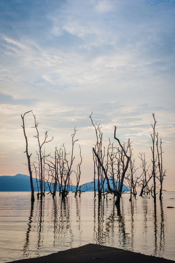 An Arctic sunset made abstract, blurring parts of the cloud layer and sea by panning the camera on a tripod with a slow exposure (0.6s)