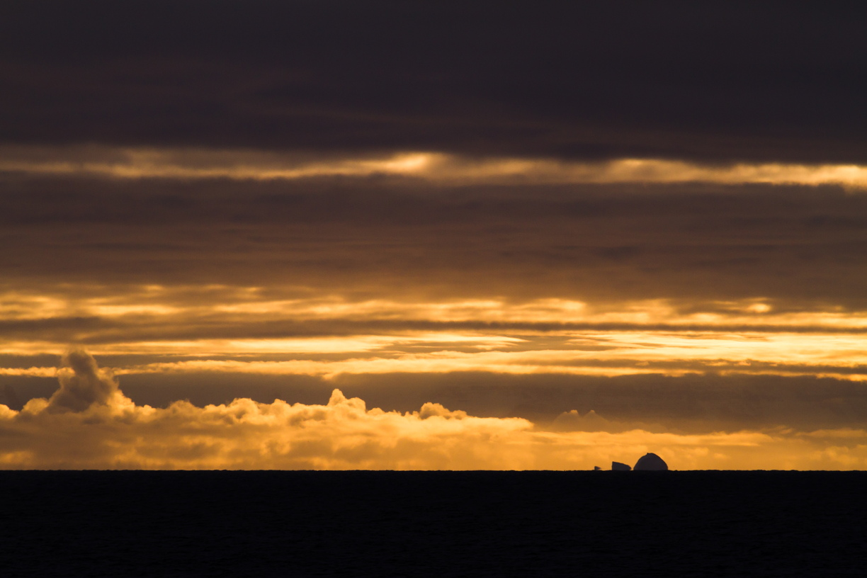 Distance icebergs form a vaguely familiar shape on the horizon as we leave the southern part of Scoresby Sund, eastern Greenland