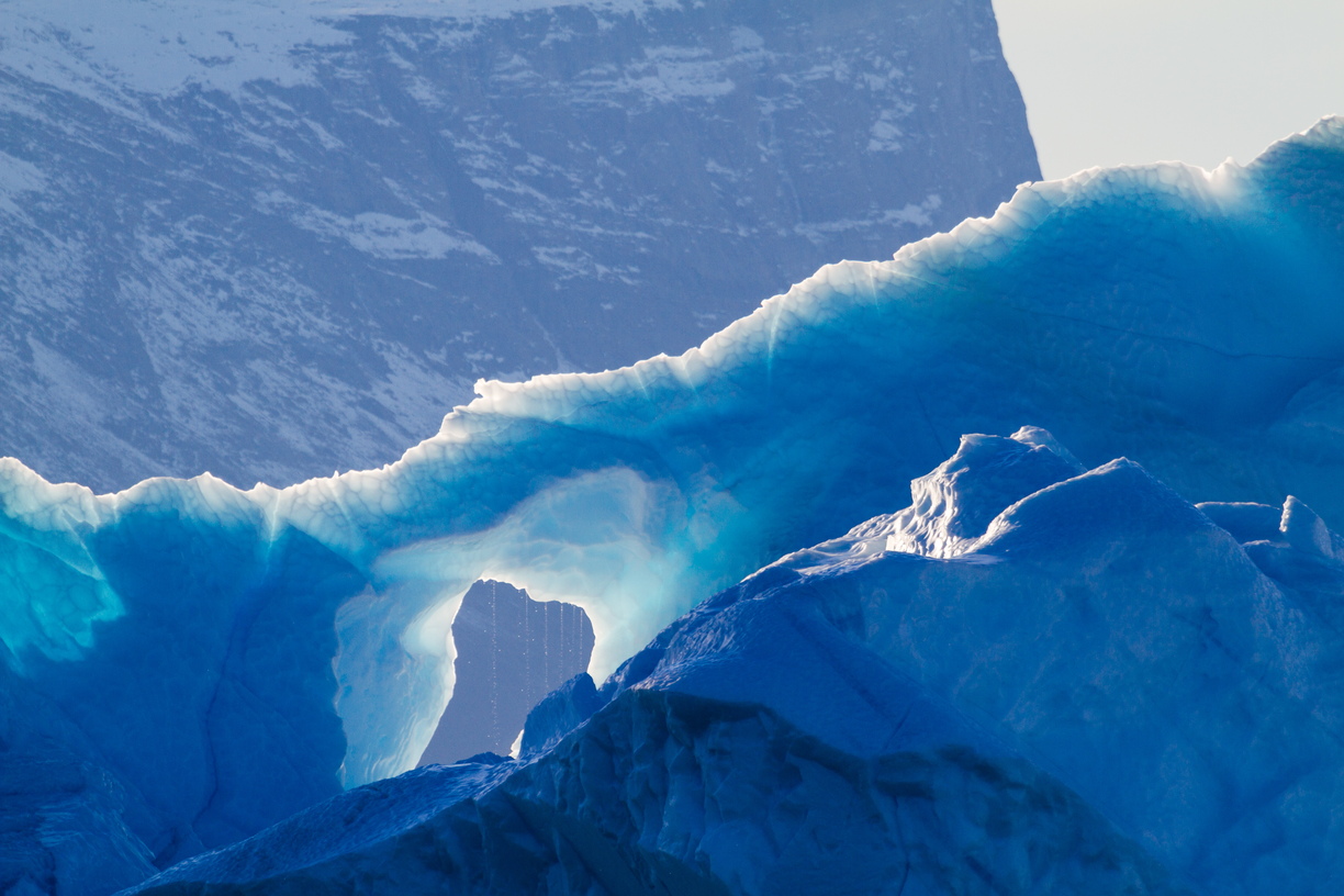 Exploring Scoresbysund by zodiac provided an opportunity to get up close and personal with the towering icebergs. Captured here in the morning sunlight, the ethereal iceberg is slowly melting, droplet by droplet