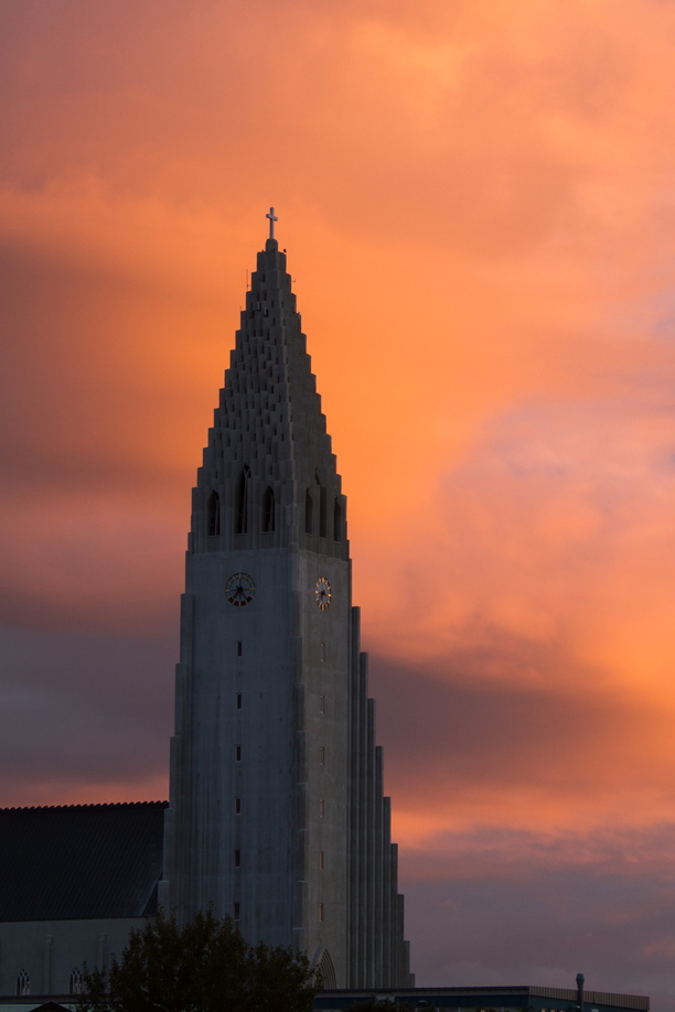 Hallgrímskirkja church nestled between sunset and Reykjavik nightrise